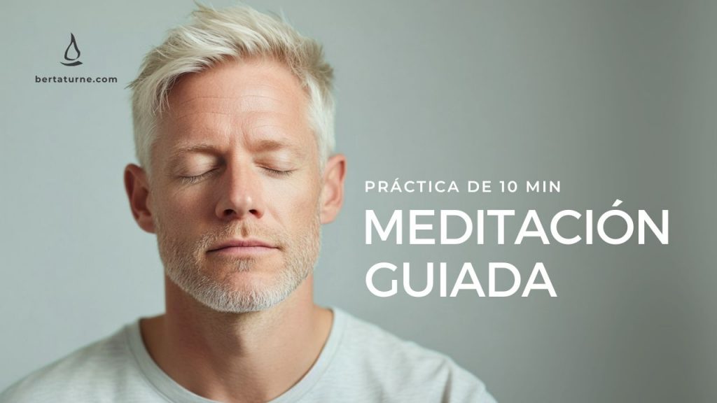 Man dressed in a white t-shirt with his eyes closed, doing a mindfulness practice.